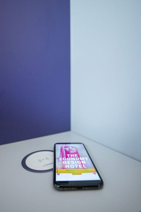 Premium bedding, desk, laptop workspace, blackout drapes