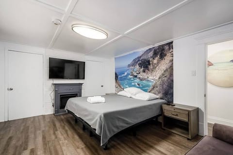 Master bedroom includes king smart/automatic bed, large 4k smart tv, and work desk.