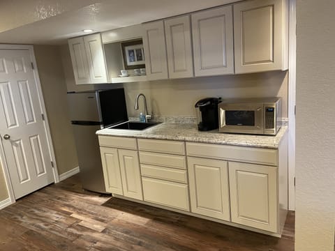 Newly installed kitchenette 12/21 with Keurig, microwave, refrigerator.