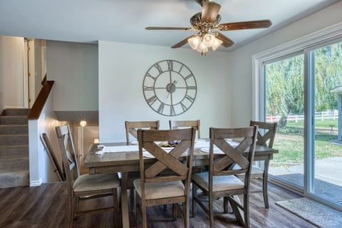 Adjacent to the kitchen, the dining area offers a large table with seating for the whole family, making it the perfect spot for shared meals and conversations.