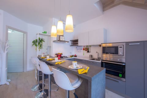 Family Apartment, 2 Bedrooms, 2 Bathrooms, Mountainside (Como Lake Modern Apartment Ulivi) | Private kitchen | Full-size fridge, microwave, oven, stovetop