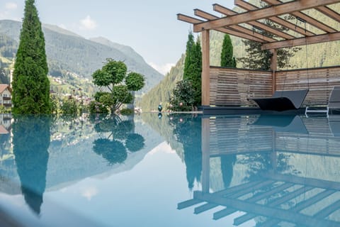 Indoor pool, seasonal outdoor pool, pool umbrellas, sun loungers