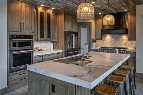 Main Floor Interior - Chefs kitchen with stainless-steel appliances.