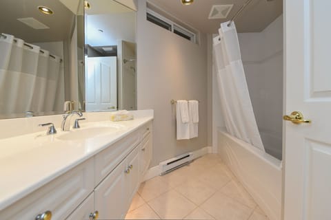Deluxe Room, 2 Queen Beds | Bathroom | Shower, free toiletries, hair dryer, towels
