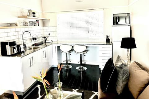 Studio Apartment B with Ocean View in Green Point | Private kitchen | Fridge, microwave, coffee/tea maker, electric kettle