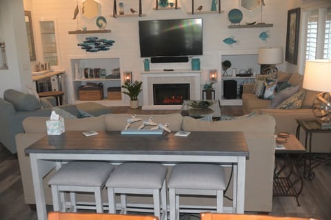 Added sofa table with bar stools and charging 2023