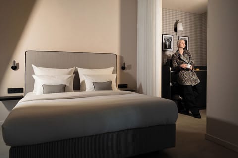 Suite | Premium bedding, individually decorated, blackout drapes, soundproofing