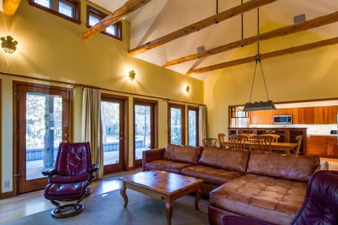 Step out from the living room out to covered deck with brand new BBQ grill