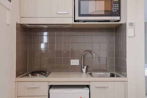 Suite, 1 King Bed, Non Smoking | Private kitchen | Fridge, microwave, stovetop, coffee/tea maker