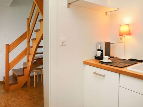 Property, Furniture, Cabinetry, Table, Building, Wood, Orange, Comfort, Interior Design, Lamp