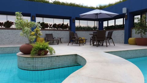 Outdoor pool, pool umbrellas, sun loungers