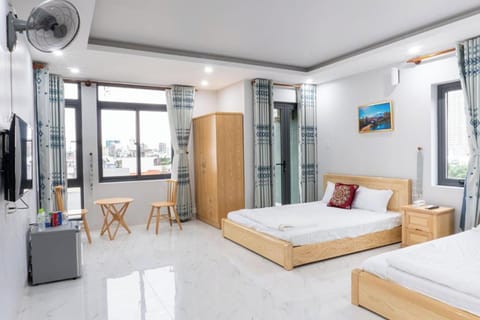 Deluxe Family Room with Balcony | Minibar, desk, free WiFi, bed sheets