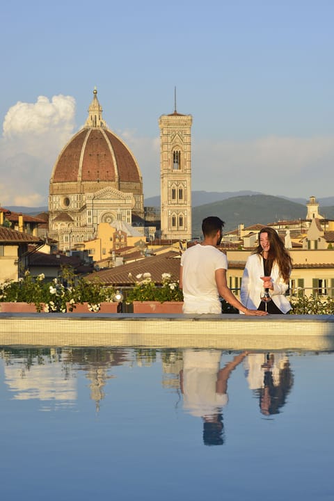 Seasonal outdoor pool, open 9:00 AM to 7:00 PM, pool umbrellas