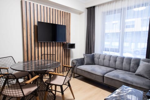 Deluxe Room, 1 Bedroom | Living room | Smart TV, heated floors