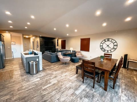 Open concept living area with dining table to seat 8.