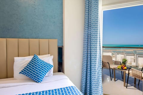 Deluxe Sea View Room | Minibar, in-room safe, iron/ironing board, free WiFi