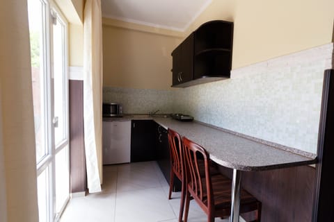 Apartment, 2 Bedrooms | Private kitchen | Fridge, microwave, stovetop, electric kettle