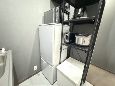 URBAN STAY SHINJUKU EAST102 | Private kitchen | Fridge, microwave, stovetop, electric kettle