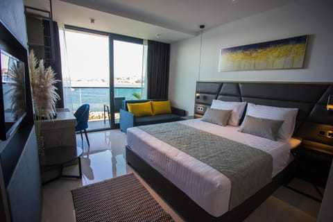 Deluxe Room, Balcony, Sea View | Memory foam beds, minibar, in-room safe, individually furnished