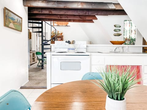 COOK • All the basics plus essentials like a coffee pot and wine glasses.