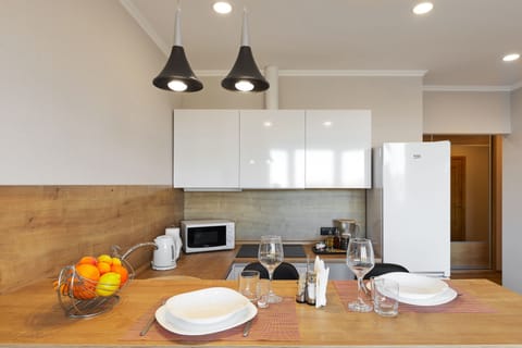 Comfort Apartment | Private kitchen | Full-size fridge, microwave, stovetop, dishwasher