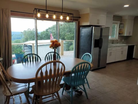 Main Level Dining Room with Scenic View and Slider to Spacious Deck