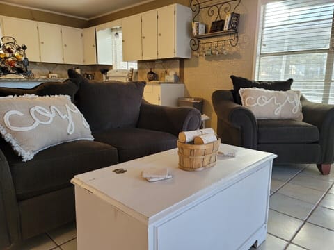 Living room with coffee table containing games for the whole family!