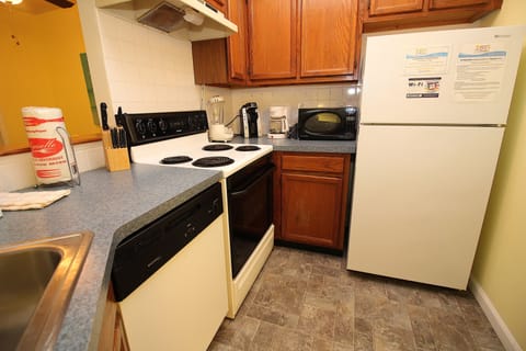 Standard Condo, 2 Bedrooms | Private kitchen | Full-size fridge, microwave, oven, stovetop