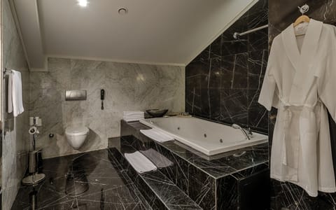 Presidential Suite | Bathroom amenities | Deep soaking tub, free toiletries, hair dryer, slippers