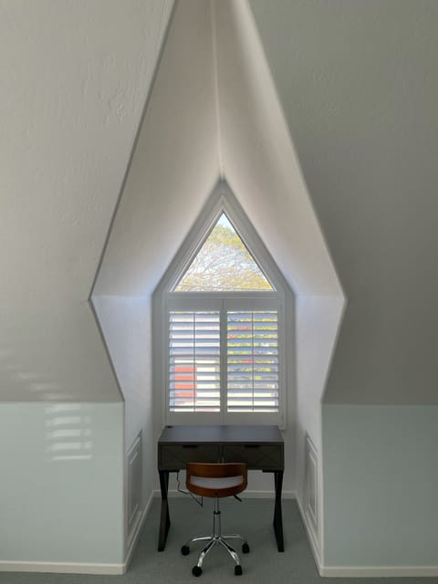 Architectural cutout w/two-drawer writing desk in main bedroom suite