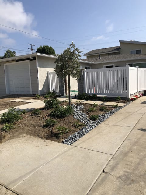 Entry Through Custom-Made Gate into Outdoor Lounging Area