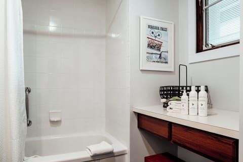 Deluxe 2 Queen Beds | Bathroom | Free toiletries, hair dryer, towels, soap