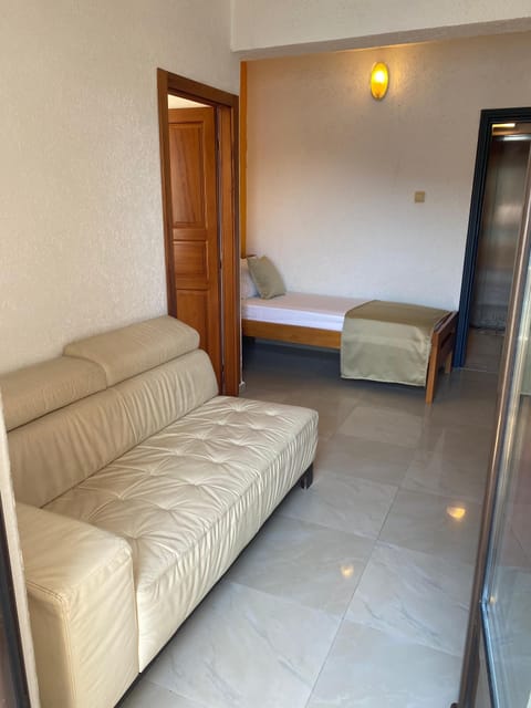 Standard Triple Room, Sea View | Minibar, in-room safe, desk, iron/ironing board