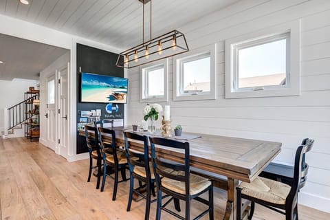 The second level dining area includes large seating area for 8 and flat screen TV.