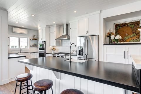 The second level kitchen includes stainless steel large appliances, as well as dishes, cooking, baking and meal prep gear. See listing description for more details.