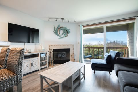 Condo | Living room | 40-inch flat-screen TV with cable channels, Smart TV, fireplace
