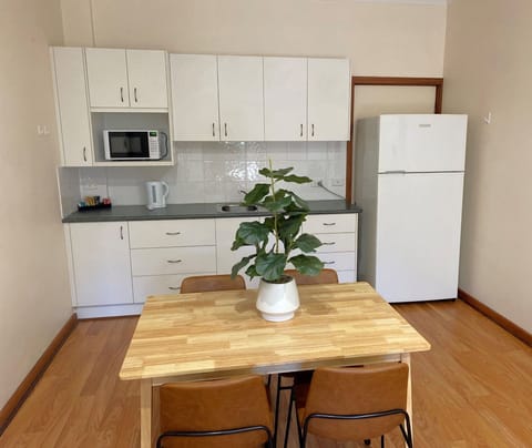 Apartment, 2 Bedrooms | Private kitchenette | Mini-fridge, microwave, coffee/tea maker, toaster