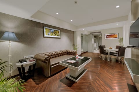 Executive Suite | Living area | 101-cm LCD TV with satellite channels, TV