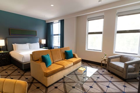 Junior Suite, 1 King Bed | Living area | 55-inch Smart TV with cable channels, TV, streaming services