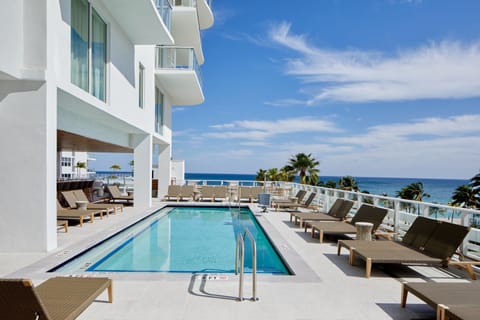 Outdoor pool, pool umbrellas, sun loungers