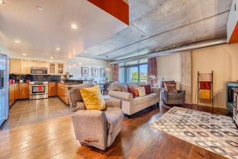 Relax in Style – Cozy up in this chic boho-inspired living room with plush seating and floor-to-ceiling windows.