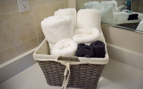 Designer toiletries, hair dryer, towels, soap