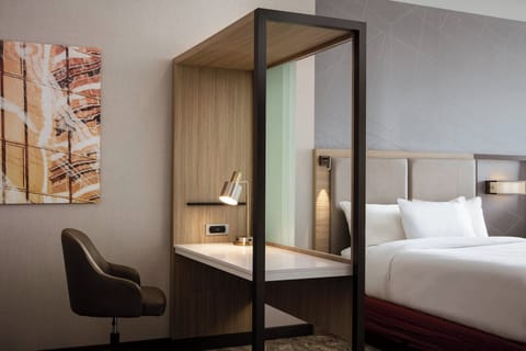 Suite, 2 Queen Beds | Desk, laptop workspace, iron/ironing board, rollaway beds