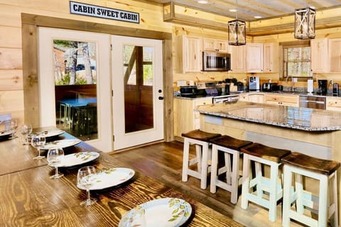 Four additional guests can sit at the island. The doors lead to outdoor seating.