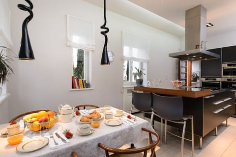 First-floor kitchen and dining area of the luxury family villa for vacation and rent in Split