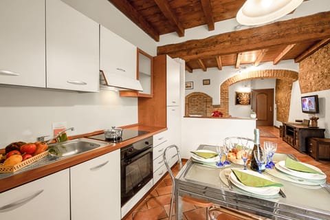 Family Apartment, 2 Bedrooms (Laura - Center Salò - Child Friendly) | Private kitchen | Fridge, oven, stovetop, dishwasher