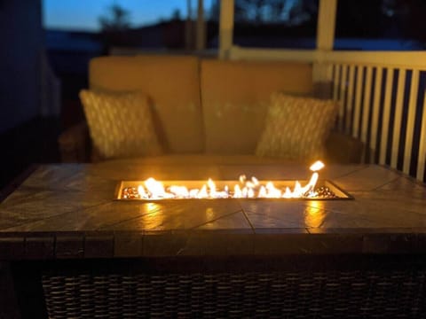 The fire table provides a warm place to sit while watching the stars at night