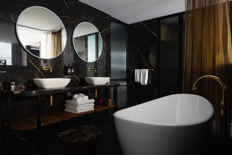 The Suite | Bathroom | Designer toiletries, hair dryer, bathrobes, slippers