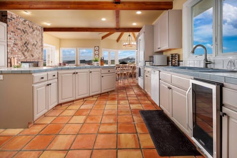 There is a large, fully stocked kitchen that is fun to cook in for a crowd and the living spaces are large and comfortable for all to share. -Bridget