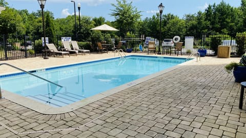 Outdoor pool, open 8:00 AM to 10:00 PM, pool umbrellas